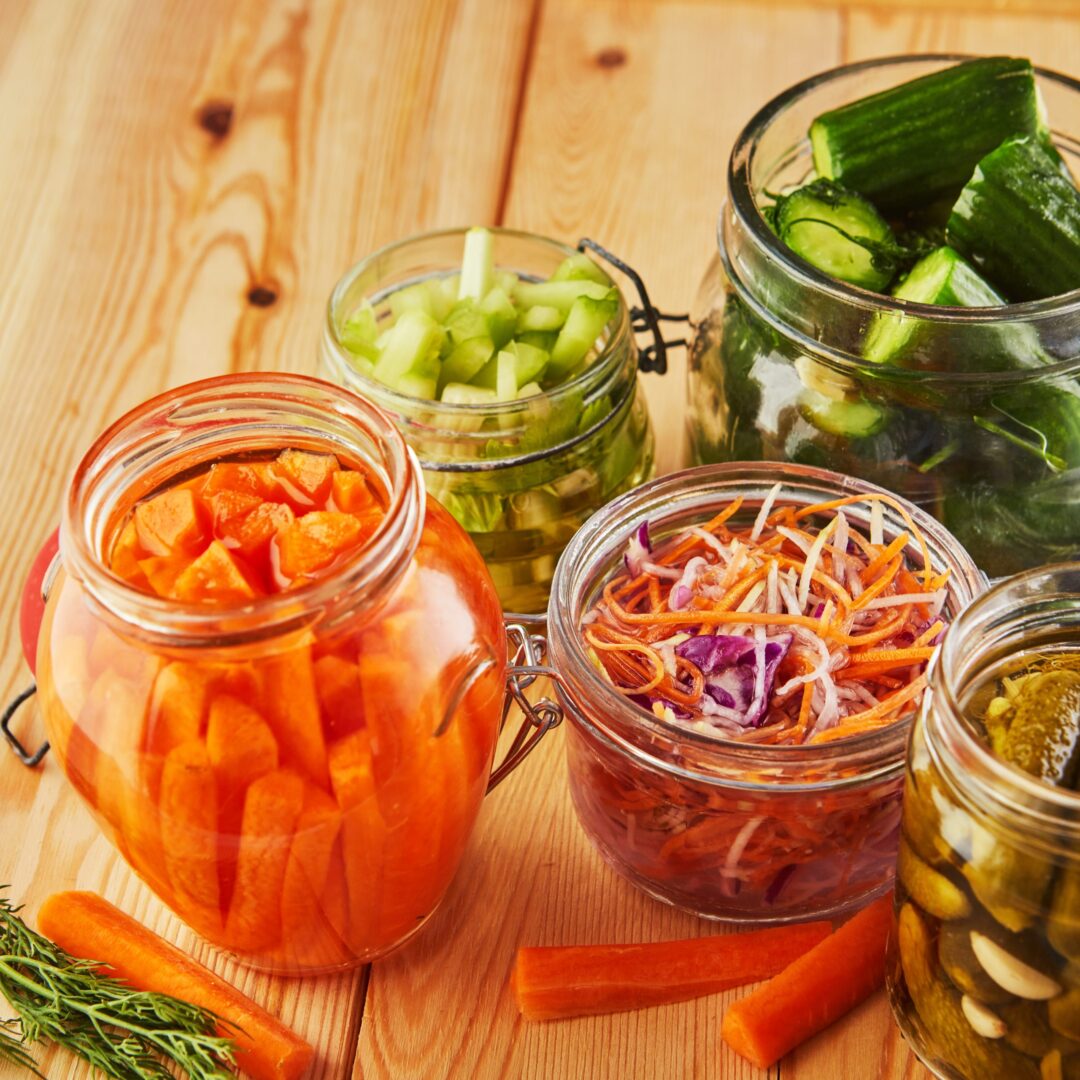 A colorful presentation of healthy fermented foods on a table.