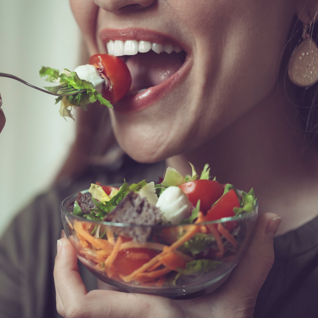 A woman chews her food