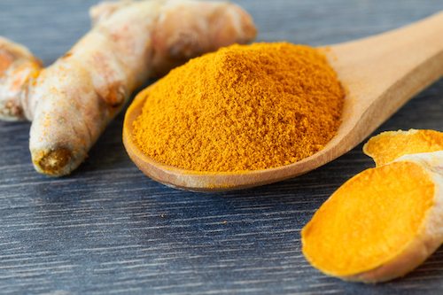 Turmeric root and powder, close up