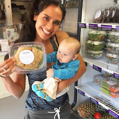 Picture of Kimberly holding Lil Bub and a wrap from Glow Bio.