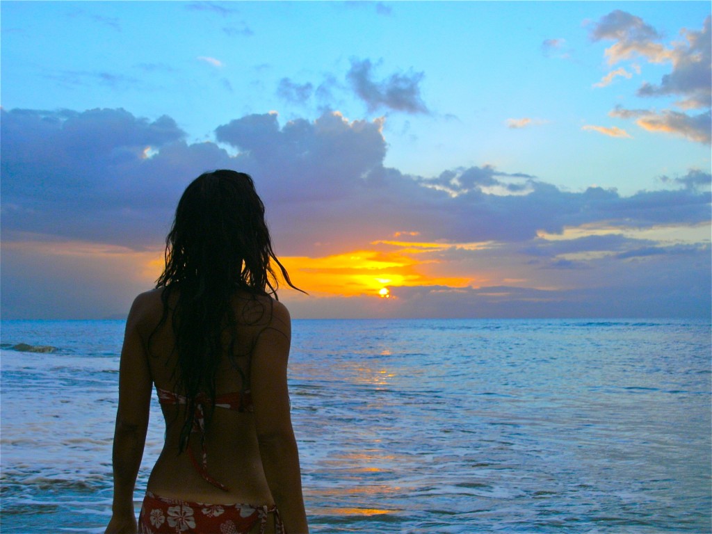 Image of Kimberly on the beach watching the sunrise.