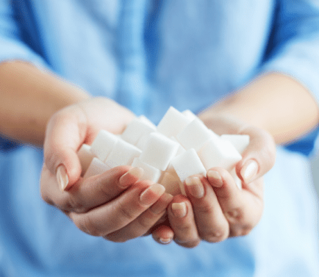 Close up of sugar cubes in cupped woman's hands