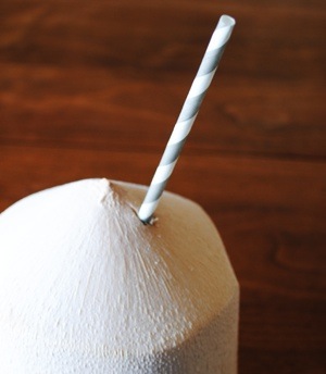 Image of coconut with a straw