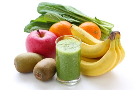 Picture of fruits and vegetables with a smoothie next to it