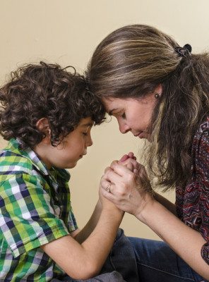 Picture of a mom and son praying together