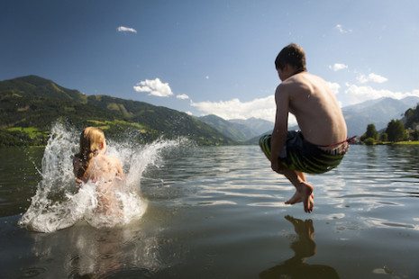 Picture of a boy jumping into a lake