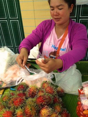 Picture of woman helping with fresh fruit