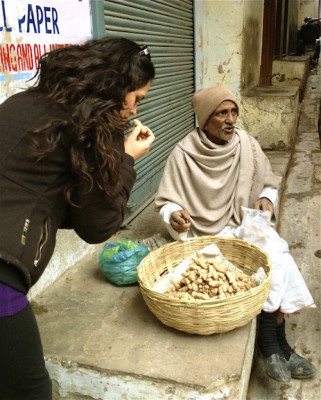 Picture of Kimberly smelling food from a street vendor