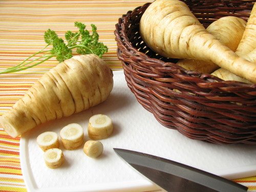 Picture of parsnips in a basket and cutting board