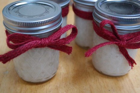 Picture of body scrub inside mason jars with bows