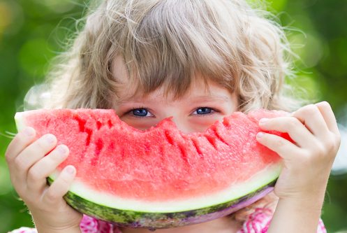 Picture of young girl eating watermelon