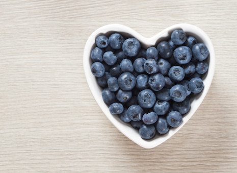 Picture of a heart-shaped bowl with blueberries in it
