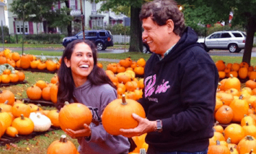 Picture of Kimberly picking a pumpkin
