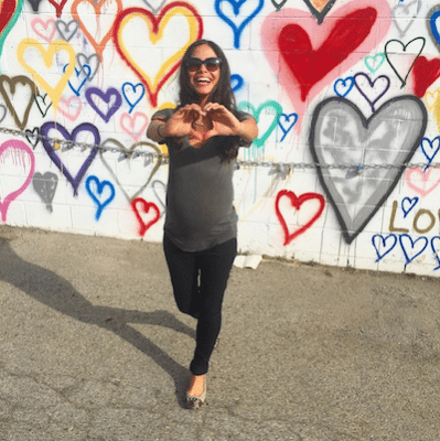 Picture of Kimberly making a heart shape with her hands