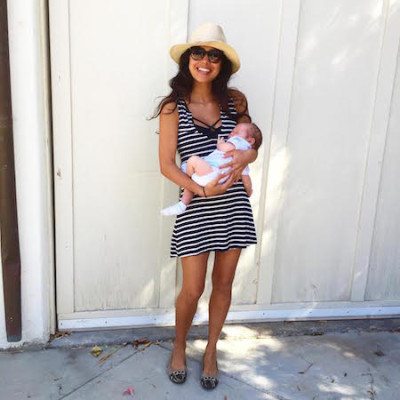 Kimberly stadning outside with baby Emerson