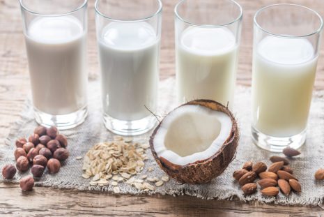 Different Types Of Non-dairy Milk On The Wooden Background