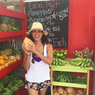 Picture of Kimberly buying fruit at a local fruit stand.