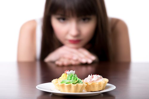 Picture of Dieting Woman Craving For Cake