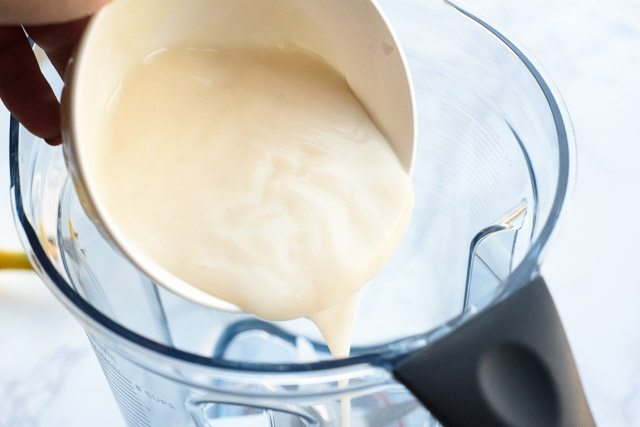  Add your vanilla coconut yogurt (like the So Delicious brand), to the blender.