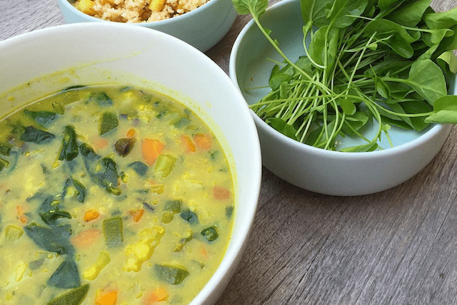 Veggie soup topped with a bunch of raw watercress is an amazing cleansing food and an easy way to add greens to your diet.