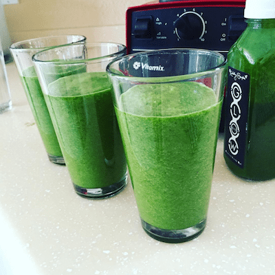 Picture of the GGS in 3 glasses with the Vitamix in the background. 