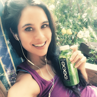Picture of Kimberly Snyder drinking a Glowing Green Smoothie. #ggs #vegan #smoothies