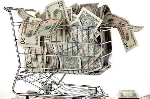 Picture of grocery cart full of cash.