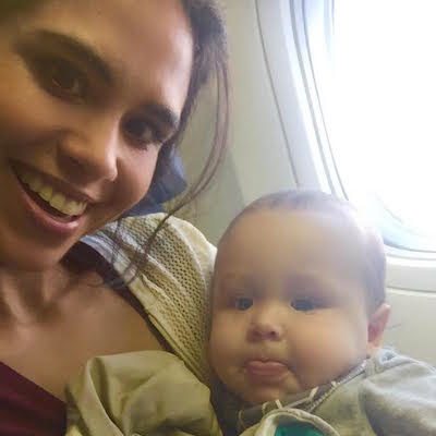 Picture of Kimberly holding Lil Bub on plane.