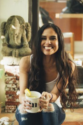 Picture of Kimberly holding a cup of tea.