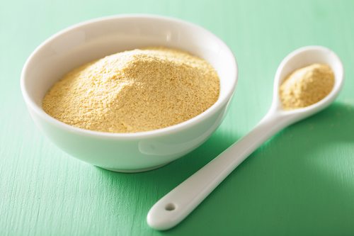 Picture of vegan nutritional yeast flakes in bowl.