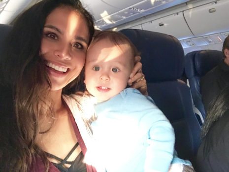 Picture of Kimberly and Lil Bub on a plane.