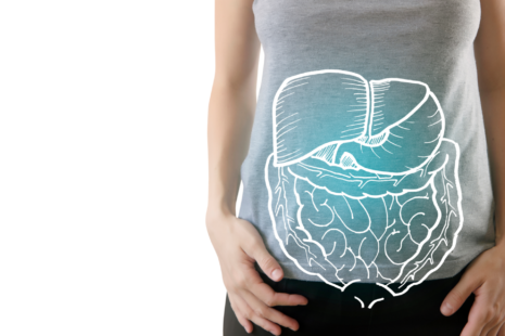 A woman's torso with a diagram of the digestive system