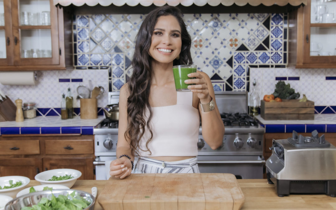 Kim in her kitchen after preparing a glowing green smoothie.