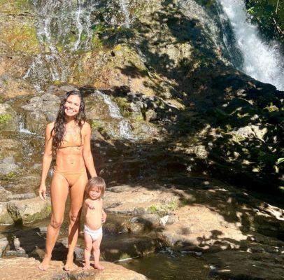 Kimberly at a waterfall with her son Moses in Hawaii 