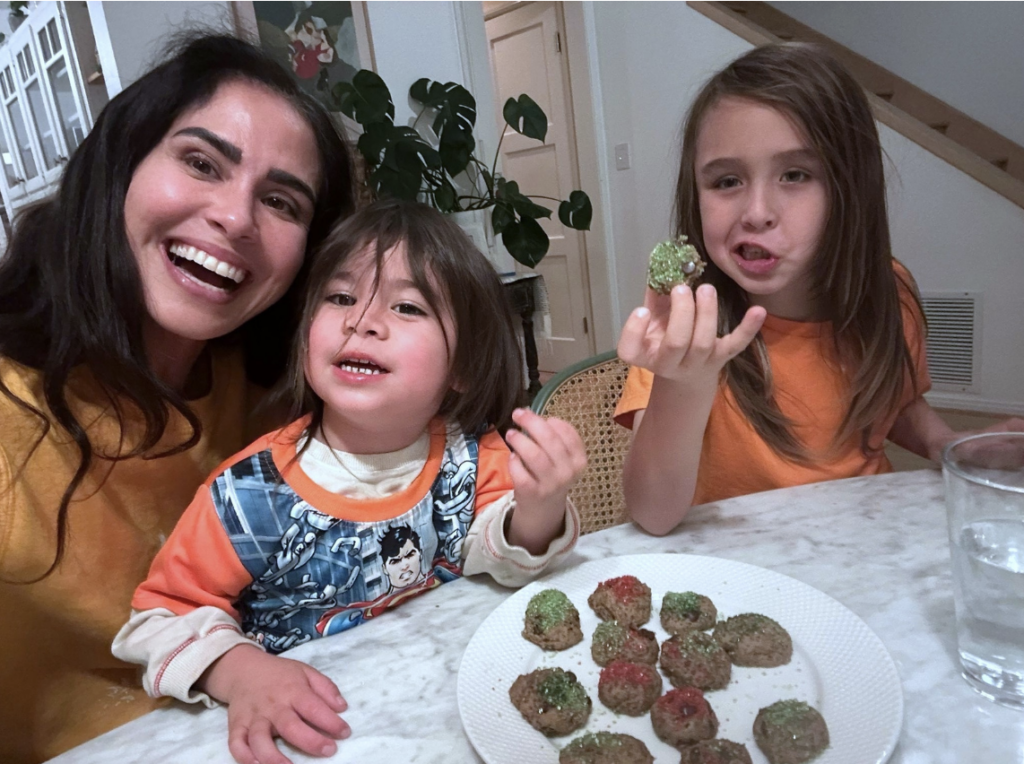 Kimberly Snyder eating vegan chocolate chip cookies with her two children.
